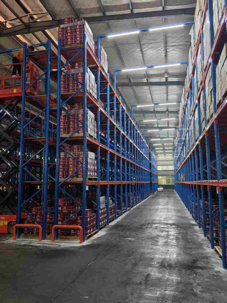 Wide aisle spacing around pallet beam racking systems for safer warehouse design