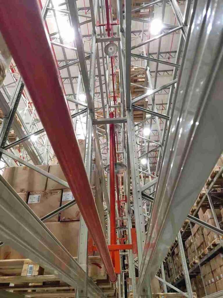 3D engineering design of an integrated fire safety narrow aisle warehouse system with fire barriers and sprinklers.