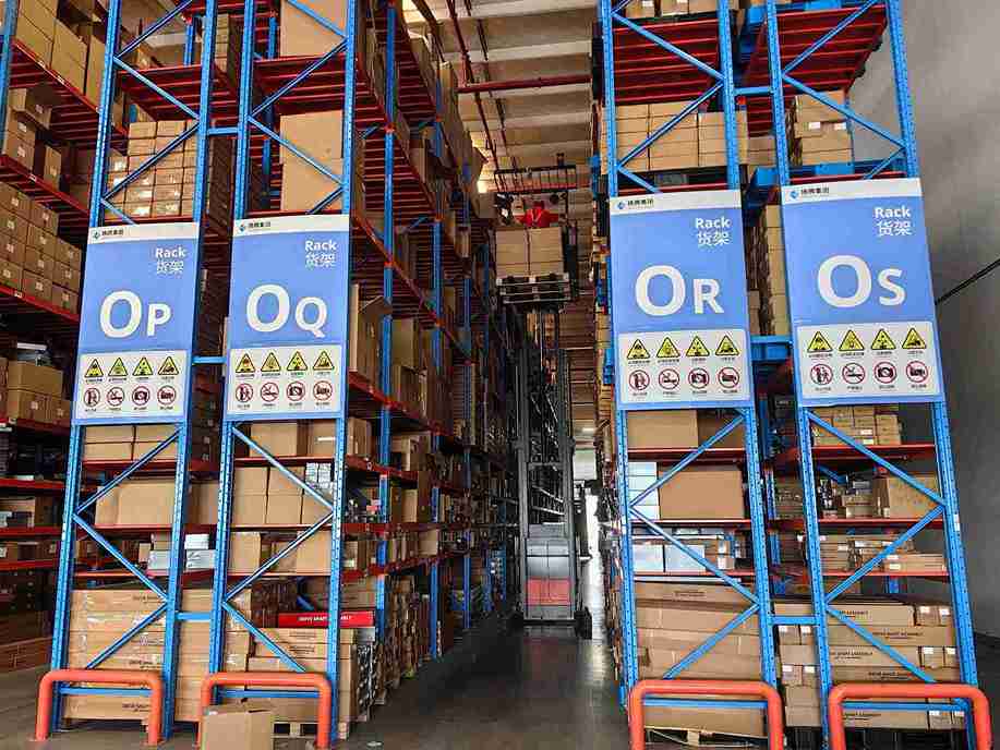 AGV and automation integration with narrow aisle racking for retail storage system.