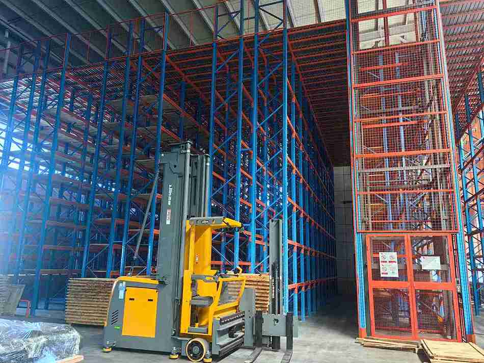 AGV integrated with automated mobile pallet racking systems for lights-out operations.