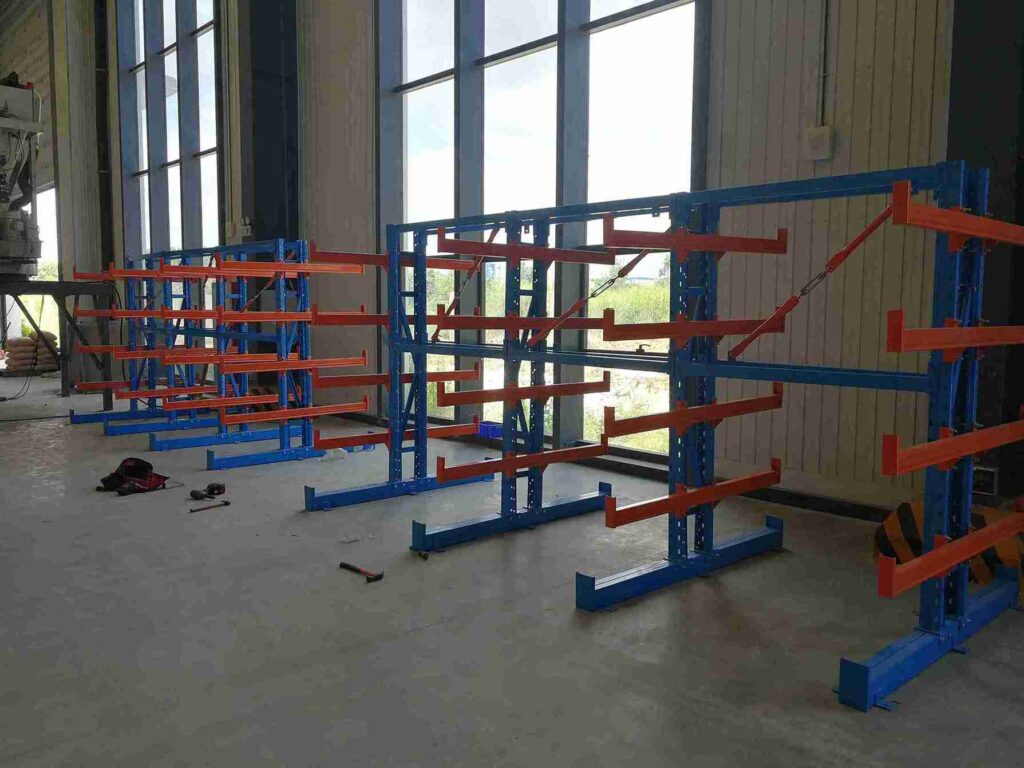 Cantilever pallet racking system with heavy-duty steel arms for long item storage