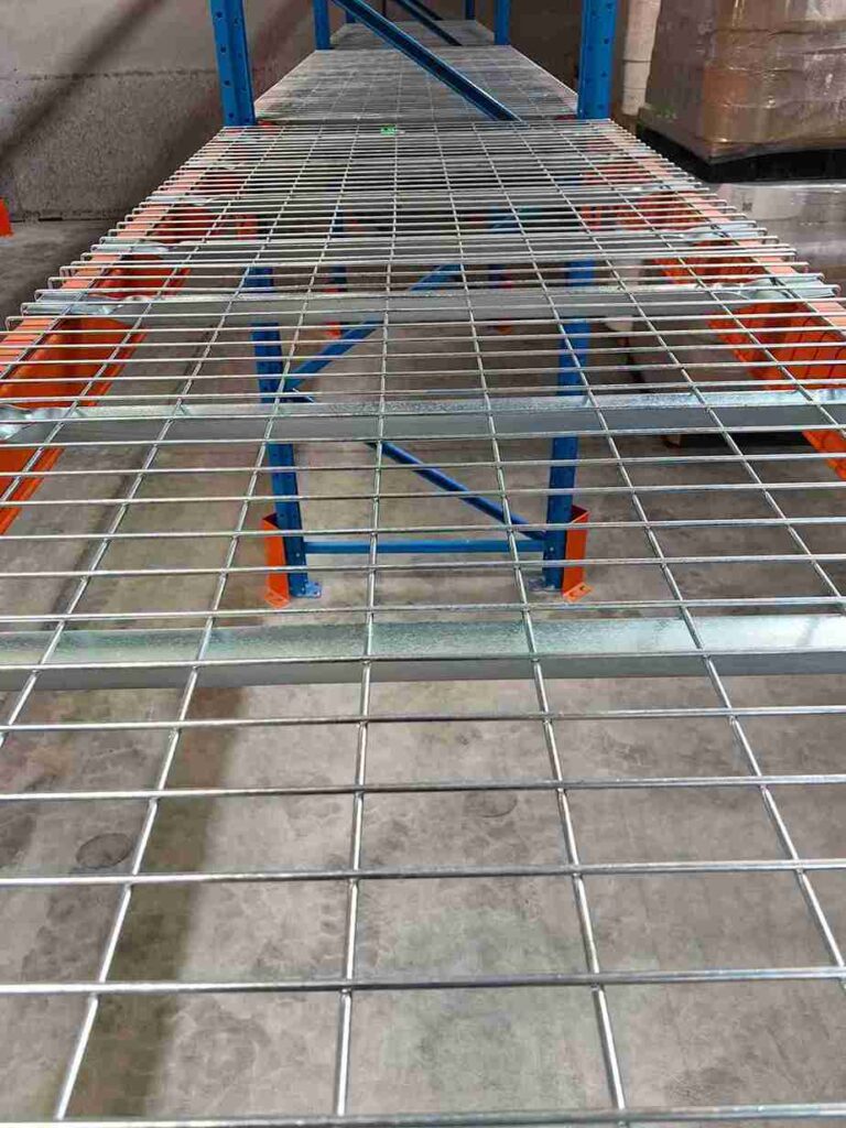 Comparison of a galvanized vs. corroded pallet racking safety clip demonstrating long-term durability.