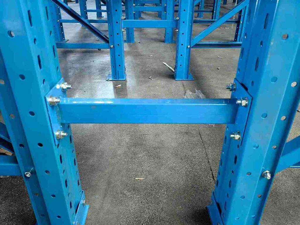 Engineering cross-section of a bolted pallet rack safety barriers system.