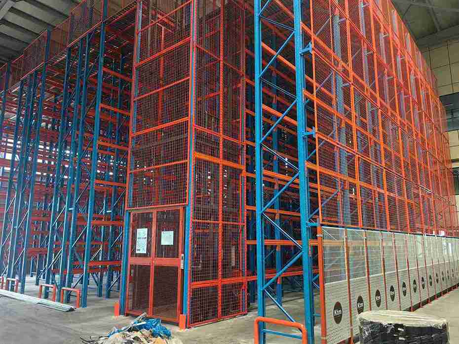 Hydraulic lift table as critical beam racking tools required for solo handling of heavy warehouse beams during installation