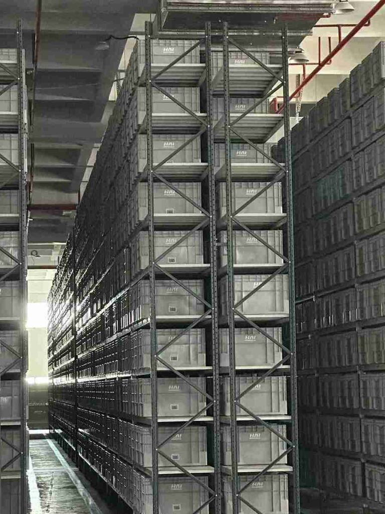 Multi-level warehouse custom narrow aisle rack layout for vertical space optimization.
