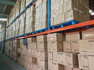Pallet racking safety standards violation showing dangerous beam deflection