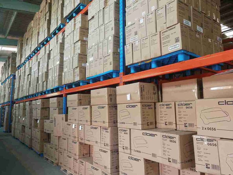 Pallet racking safety standards violation showing dangerous beam deflection