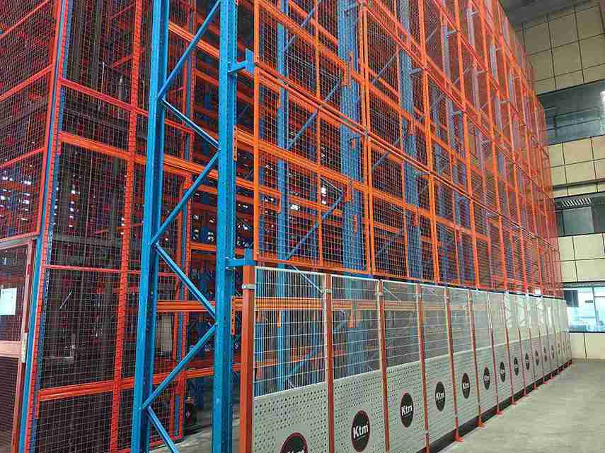 Precision warehouse rack safety barriers installed on ASRS runway columns