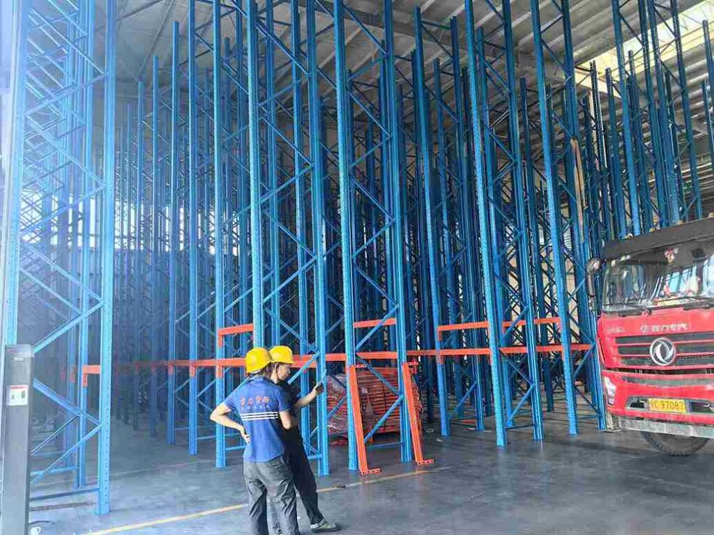 Qualified technician performing certified installation of a pallet rack damage repair kit.