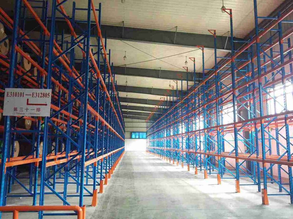 Signs of racking failure - bent warehouse rack upright column deformation