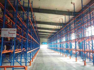 Signs of racking failure - bent warehouse rack upright column deformation