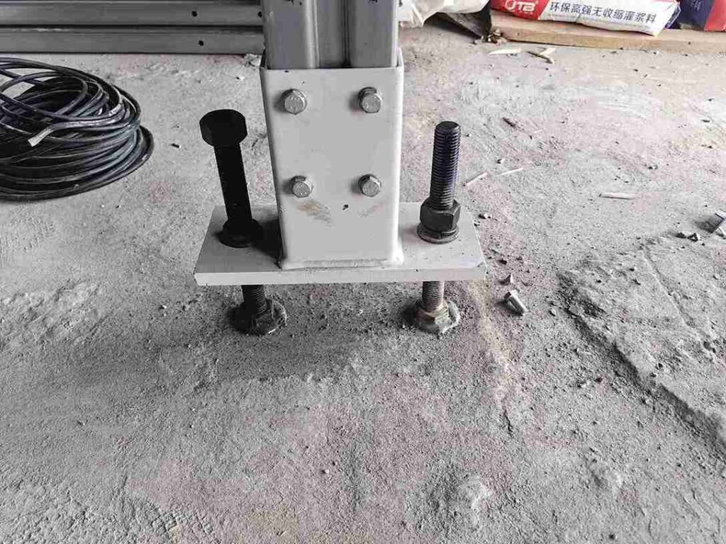 Warehouse floor settlement damaging beam racking leveling techniques application on upright baseplates