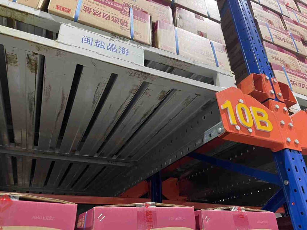 Automated high-density shuttle racking for food industry in a cold storage warehouse.