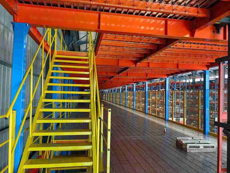 Custom modular stair platform system integrated with an ASRS for safe maintenance access.