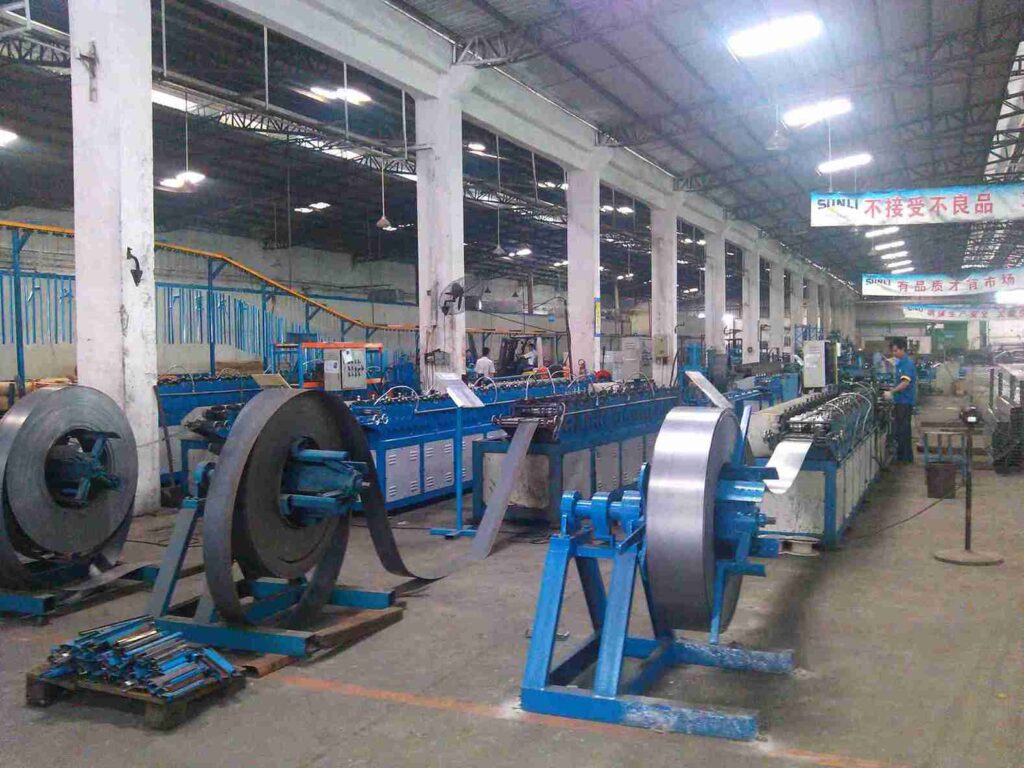 Inclined conveyor integrated into a custom mezzanine racking design for multi-level material flow