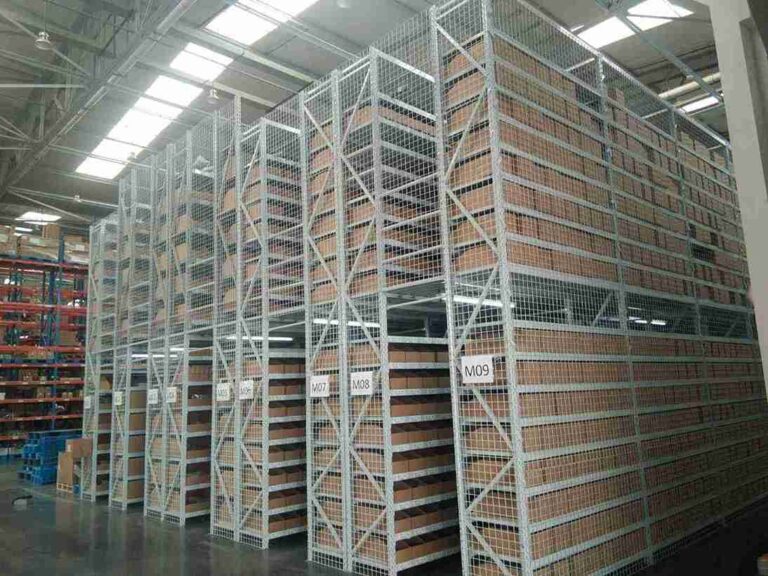 Pharmaceutical mezzanine racking with sealed, coved design for superior cleanability versus standard racking.