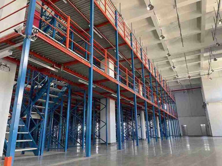 modular stair platform system installed in an industrial warehouse for mezzanine access.