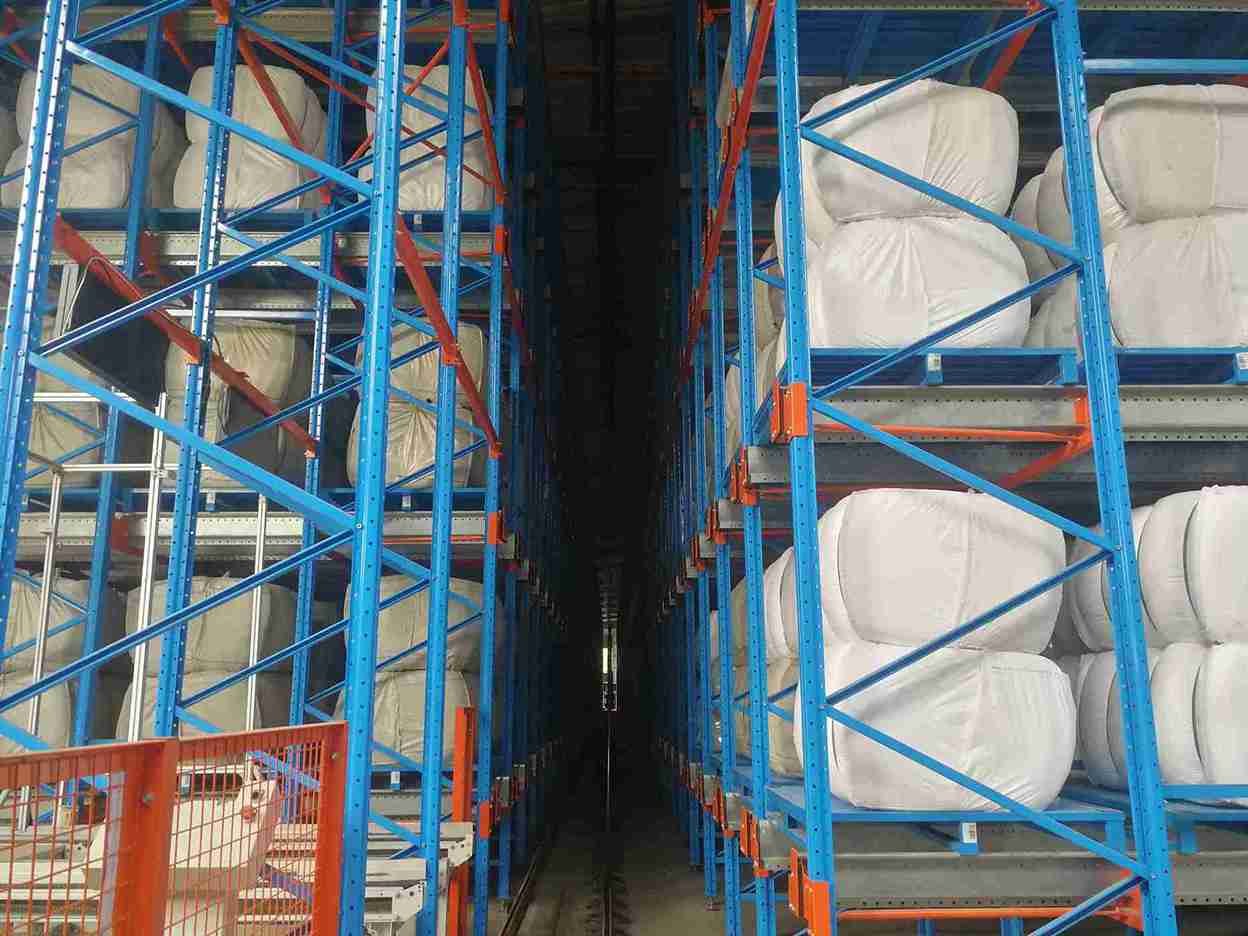 Fully integrated ASRS featuring an automated pallet shuttle system for comprehensive automotive parts logistics.